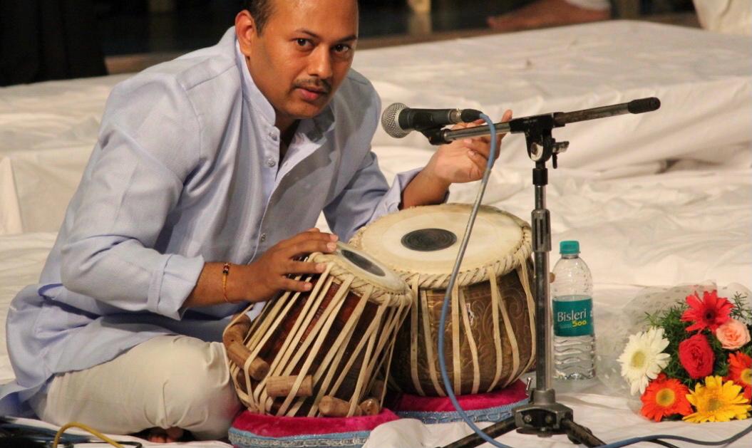 Professor playing tabla